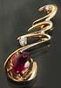 Garnet broach with microphone; Actual size=180 pixels wide
